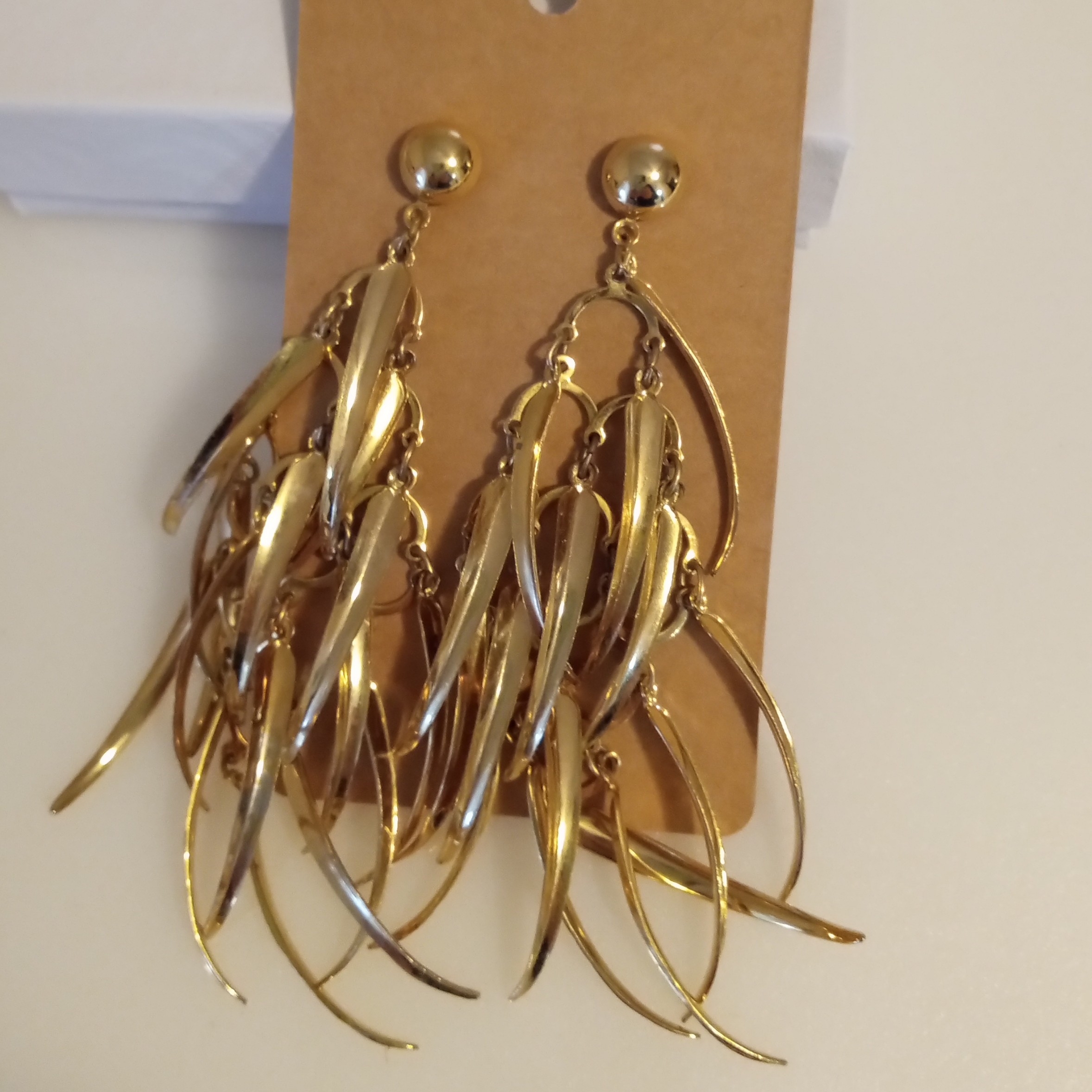 Gold Dangle Earrings With Cascading Leaf Design